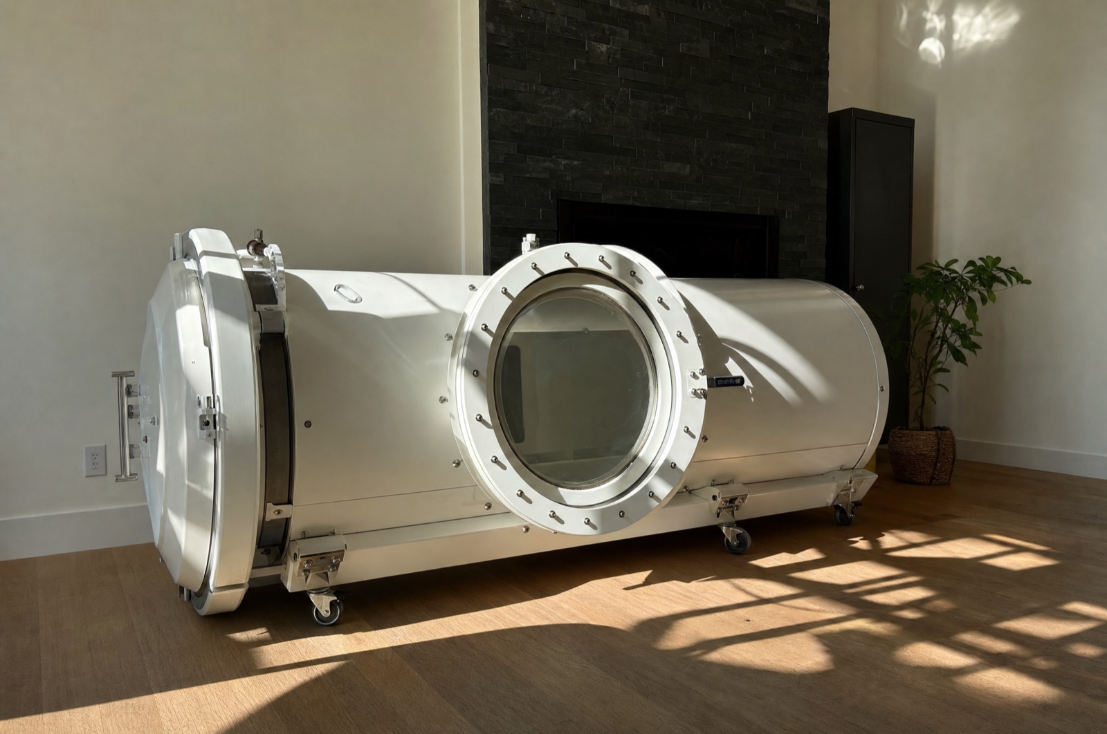 Hard-shell hyperbaric capsule in a home living room